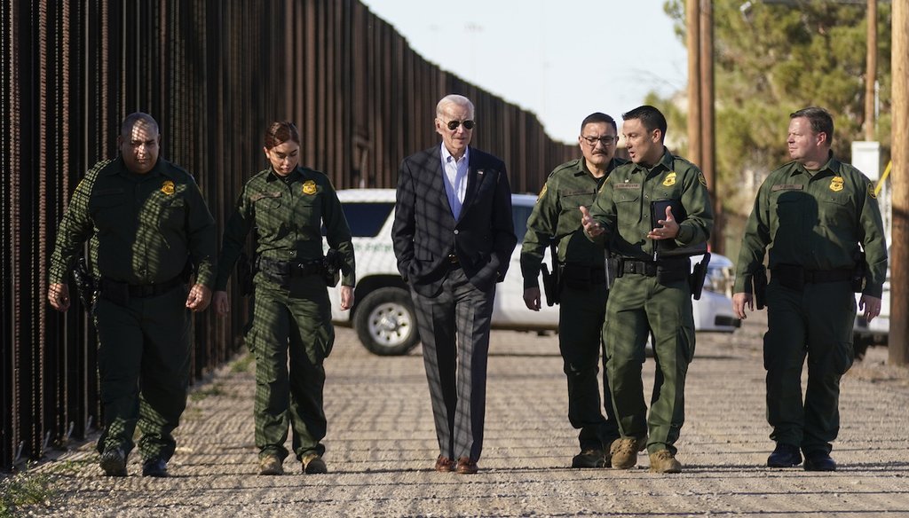 President Joe Biden talks with U.S. Border Patrol agents as they walk along a stretch of the U.S.-Mexico border in El Paso, Texas, Jan. 8, 2023. (AP Photo/Andrew Harnik)