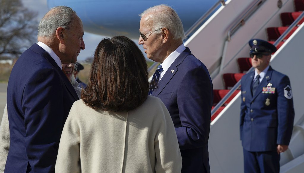 President Joe Biden talks with Senate Majority Leader Chuck Schumer of N.Y., left, and others as he arrives Oct. 27, 2022, at Hancock Field Air National Guard Base in Mattydale, N.Y. (AP)