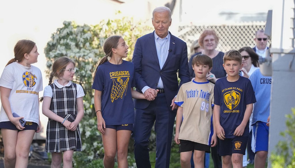 President Joe Biden walks out of his childhood home with a group of children, April 16, 2024, in Scranton, Pa. (AP)