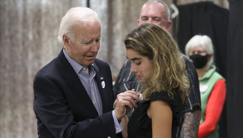President Joe Biden puts an "I Voted" sticker on his granddaughter, Natalie Biden, after they voted during early voting for the 2022 U.S. midterm elections Oct. 29, 2022, in Wilmington, Del. (AP)