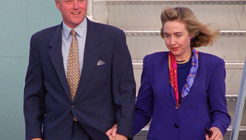 Former President Bill Clinton and First Lady Hillary Rodham Clinton arrive at Miami International Airport Oct. 15, 1994. (AP Photo/Marta Lavandier)