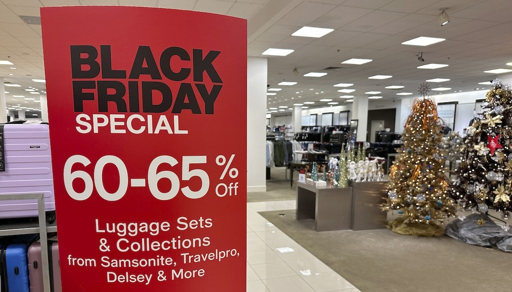 A sign announces Black Friday specials on luggage sets inside a Macy's department store on Nov. 20, 2023, in Denver. (AP)