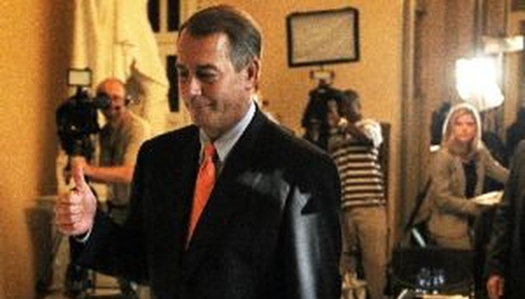 House Speaker John Boehner, R-Ohio, gives a thumbs up as he passes reporters in the Capitol after a key debt-ceiling vote on July 29, 2011.