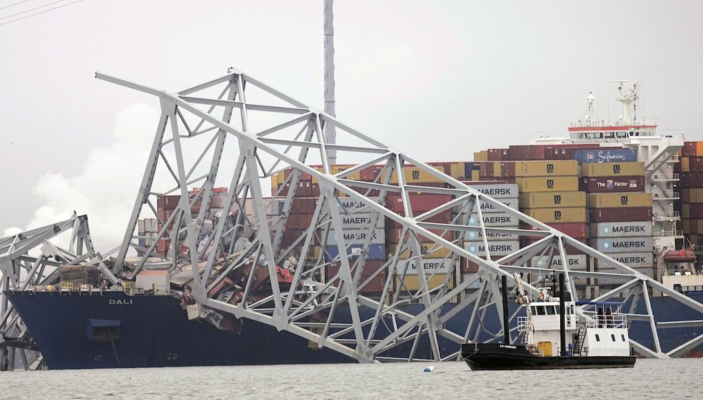 A cargo ship is stuck under the part of the structure of the Francis Scott Key Bridge on March 27, 2024, after the ship hit the bridge in Baltimore, Md. (AP)