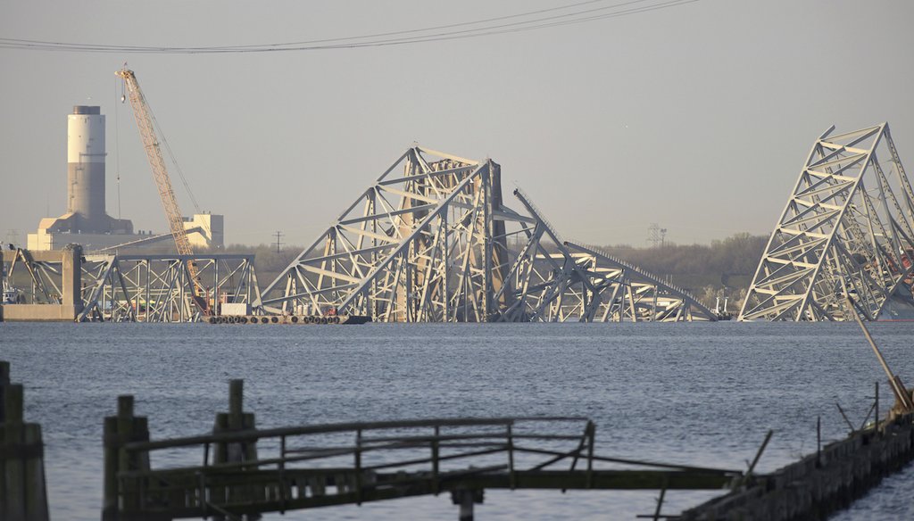 A crane is seen near the wreckage of the Francis Scott Key Bridge on March 29, 2024 in Baltimore. (AP)