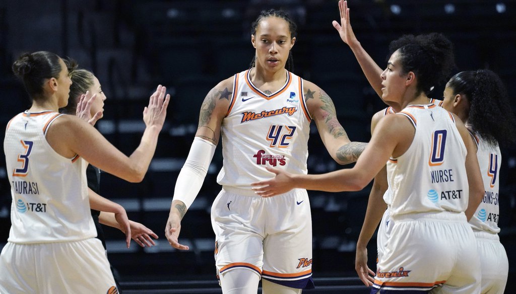 Phoenix Mercury's Brittney Griner is congratulated after a play during the WNBA basketball playoffs on Sept. 26, 2021. (AP Photo/Elaine Thompson)