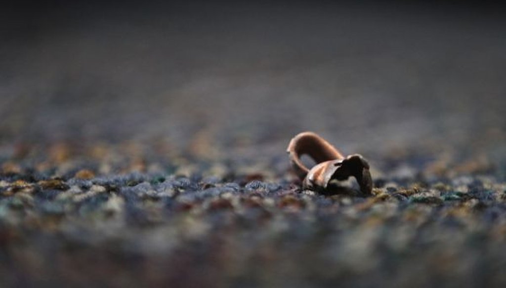A bullet fragment or casing found in Austin, Texas, following an incident in which a gunman, Larry Steve McQuilliams, targeted several buildings before being shot and killed by police on Nov. 29, 2014. (Laura Skelding/Austin American-Statesman/TNS)