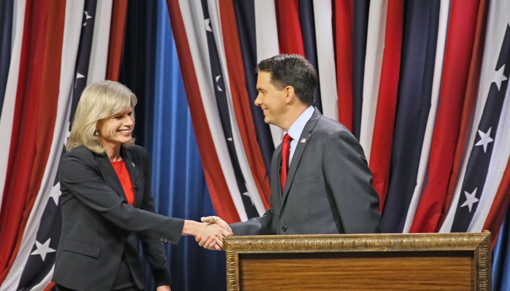 Mary Burke and Gov. Scott Walker shook hands before their final debate on Oct. 17, 2014. JS Photo Michael Sears