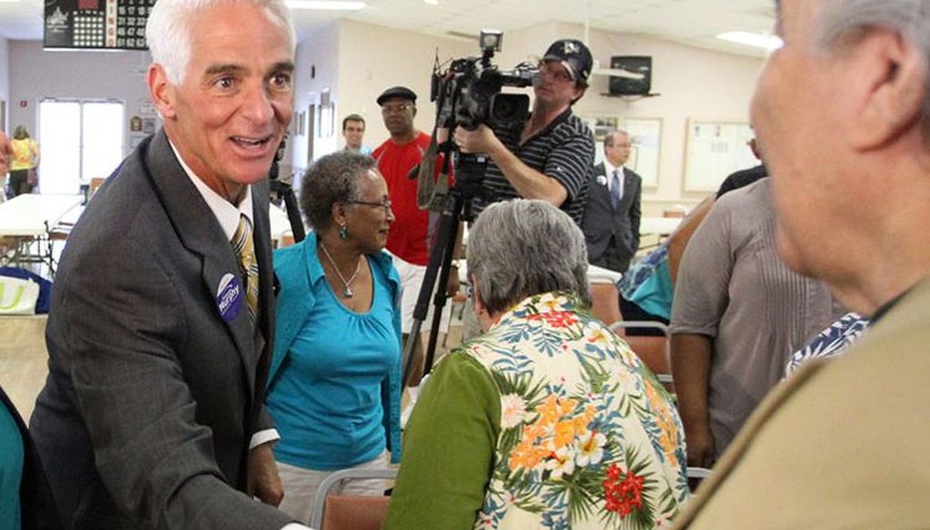 Charlie Crist greets a voter on the campaign trail. (Tampa Bay Times photo)