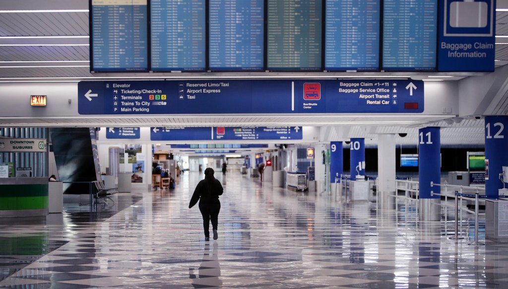 A worker walks through a baggage claim area at a nearly-empty O'Hare International Airport on April 2, 2020 in Chicago, Illinois. (Photo by Scott Olson/Getty Images)