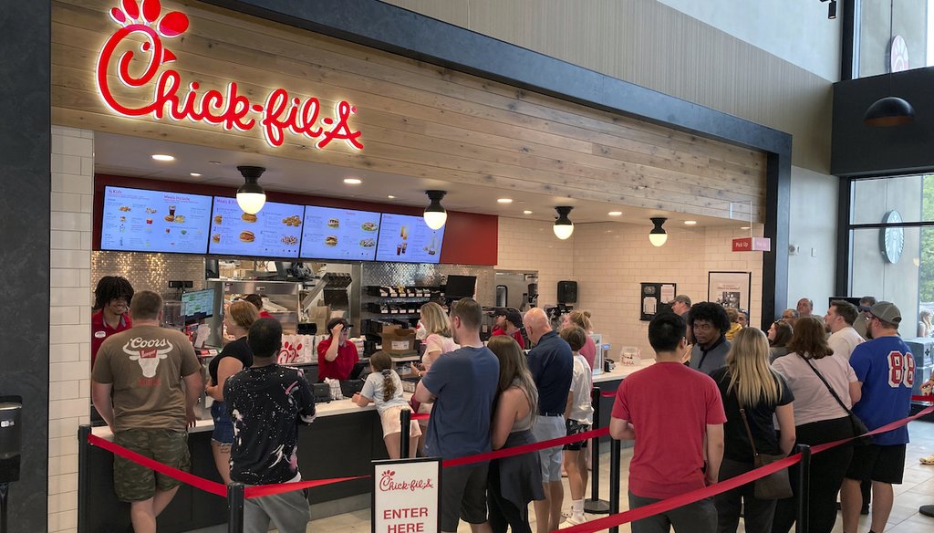 People line up to order fast food from a Chick-fil-A restaurant June 30, 2023, at the Iroquois Travel Plaza rest stop on the New York State Thruway in Little Falls, New York. (AP)