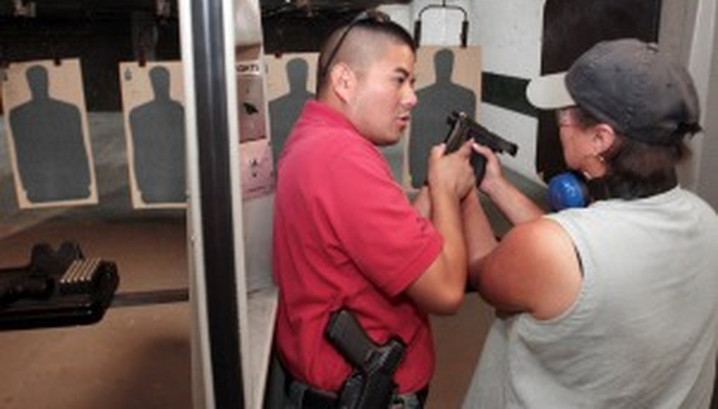 State Rep. Vicki Truitt works with a concealed handgun license instructor in 2008.
