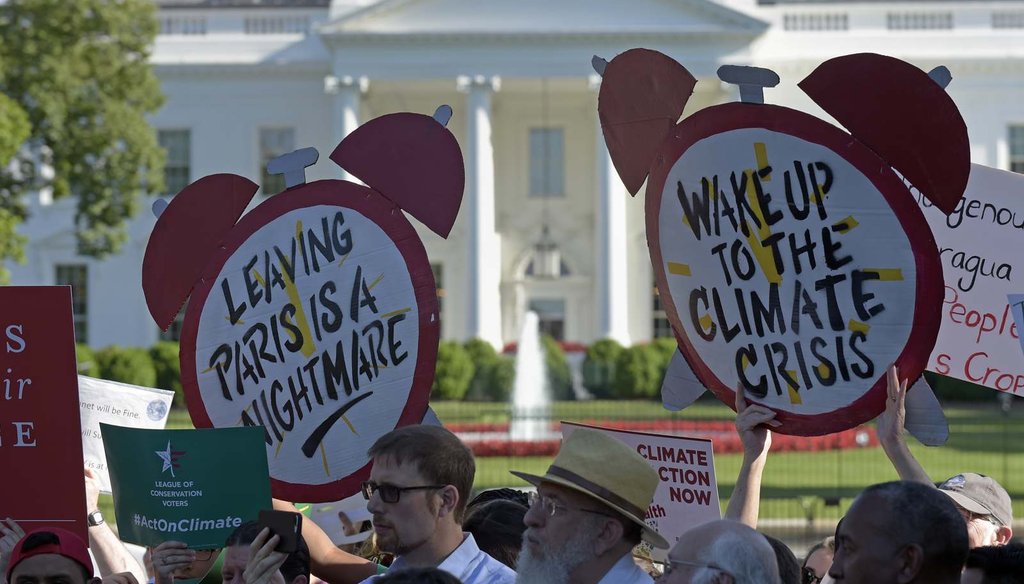  Protesters gather outside the White House in Washington June 1, 2017, to protest President Donald Trump's decision to withdraw the Unites States from the Paris climate change accord. (AP Photo/Susan Walsh) 