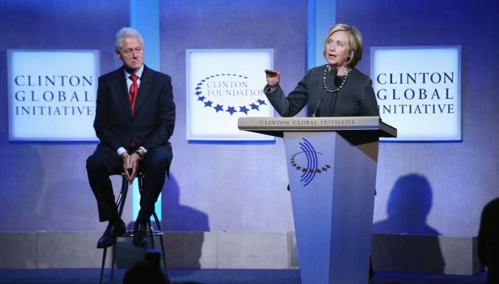 In this Sept. 22, 2014 file photo, Hillary Clinton speaks as former President Bill Clinton looks on during the opening session of the annual Clinton Global Initiative meeting in New York City. (John Moore/Getty Images)