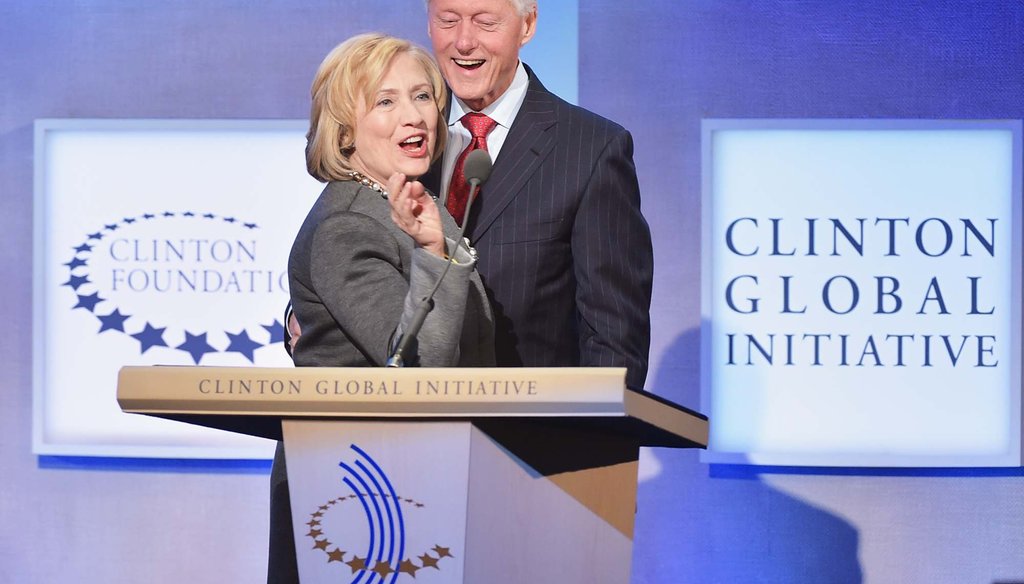 In this Sept. 22, 2014 file photo, former Secretary of State Hillary Clinton and former President Bill Clinton address the audience at the annual Clinton Global Initiative meeting in New York City. (Photo by Michael Loccisano/Getty Images)