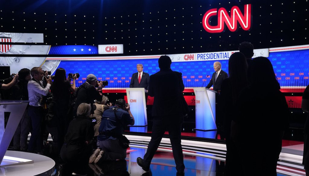Photographers take photos of President Joe Biden, right, and Republican presidential candidate former President Donald Trump, left, during a break in a presidential debate hosted by CNN, June 27, 2024, in Atlanta. (AP)