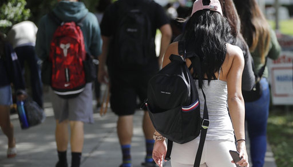 Students walk on the campus of Miami Dade College, in Miami, on Oct. 23, 2018. (AP/Sladky)