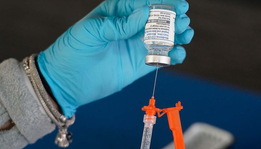 A Jackson-Hinds Comprehensive Health Center nurse loads a syringe with a Moderna COVID-19 booster vaccine Nov. 18, 2022, at an inoculation station next to Jackson State University in Jackson, Miss. (AP)