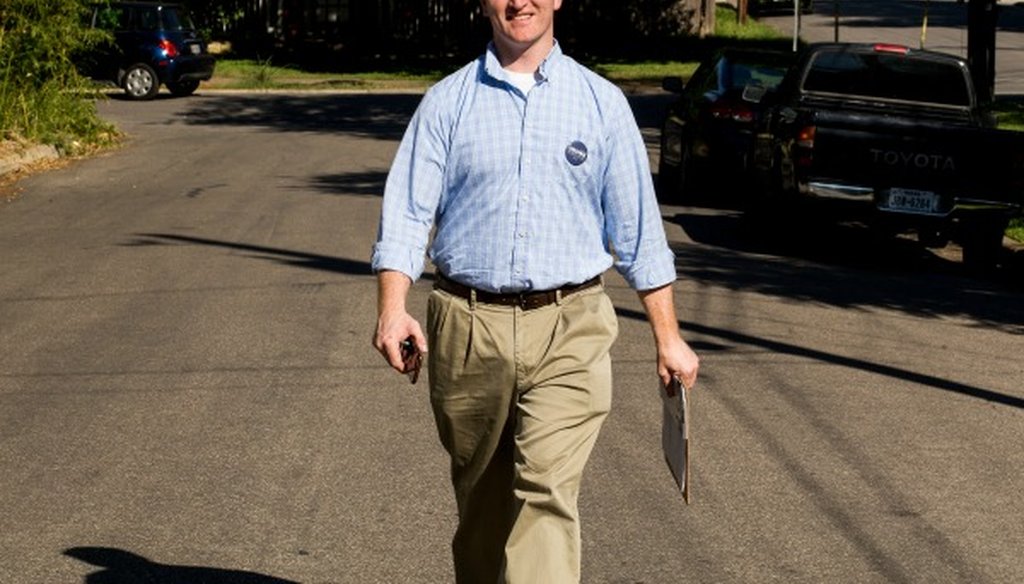 Derrick Crowe, seeking a Texas U.S. House seat, strolls in a South Austin neighborhood while greeting voters Saturday May 13, 2017 (DAVE CREANEY/Austin American-Statesman).