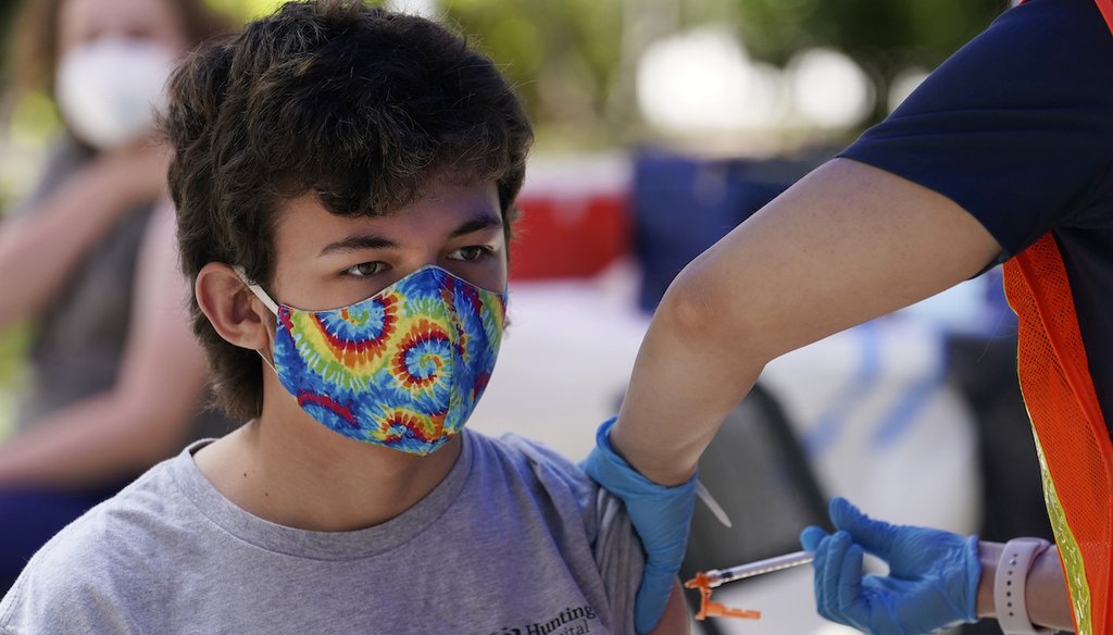 Finley Martin, 14, gets a shot of the Pfizer COVID-19 vaccine at the First Baptist Church of Pasadena, May 14, 2021, in Pasadena, Calif. (AP)