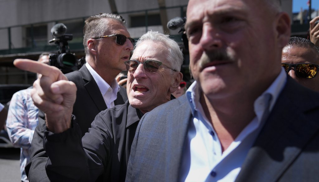 Robert De Niro, center, argues with a Donald Trump supporter May 28, 2024, in New York after speaking to reporters in support of President Joe Biden across the street from Trump's criminal trial. (AP)