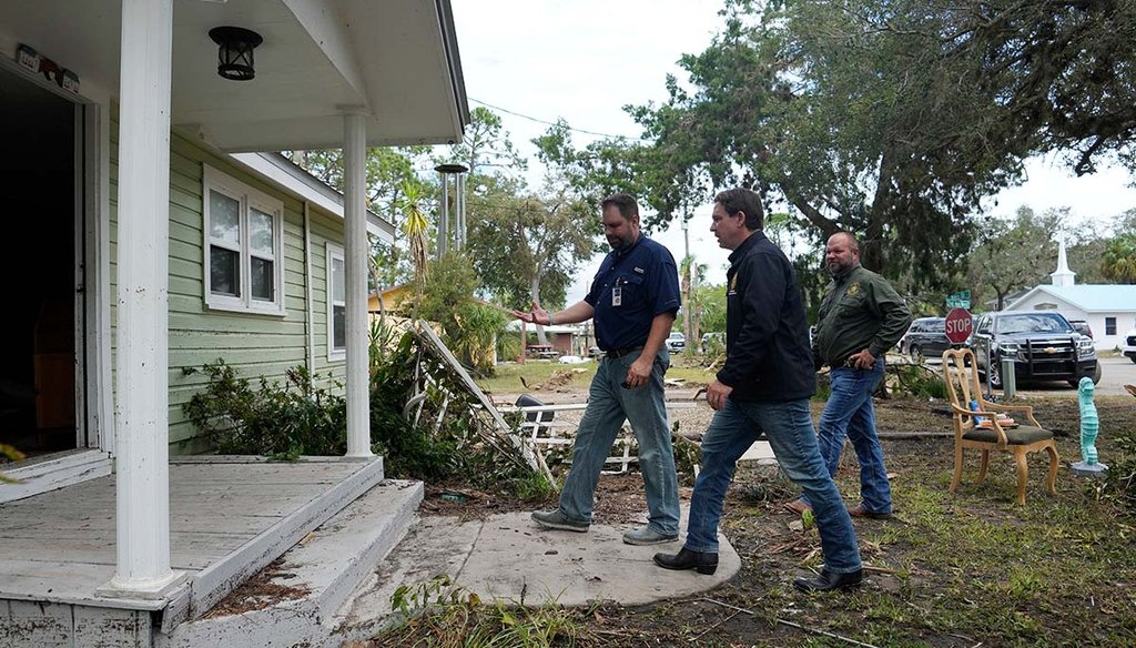 Florida Gov. Ron DeSantis, second right, visits a home that had its interior heavily damaged by storm surge during the passage of Hurricane Idalia on Aug. 31, 2023, in Horseshoe Beach, Fla. (AP)