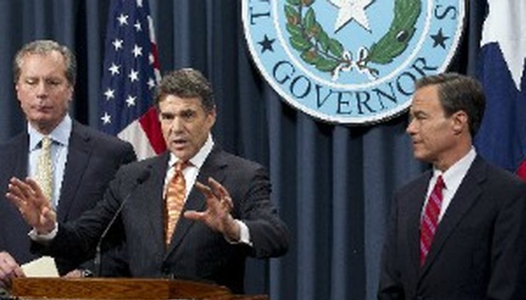 Flanked by Lt. Gov. David Dewhurst and House Speaker Joe Straus, Gov. Rick Perry makes a point at a Jan. 9, 2013, Capitol press conference (Austin American-Statesman, Deborah Cannon).