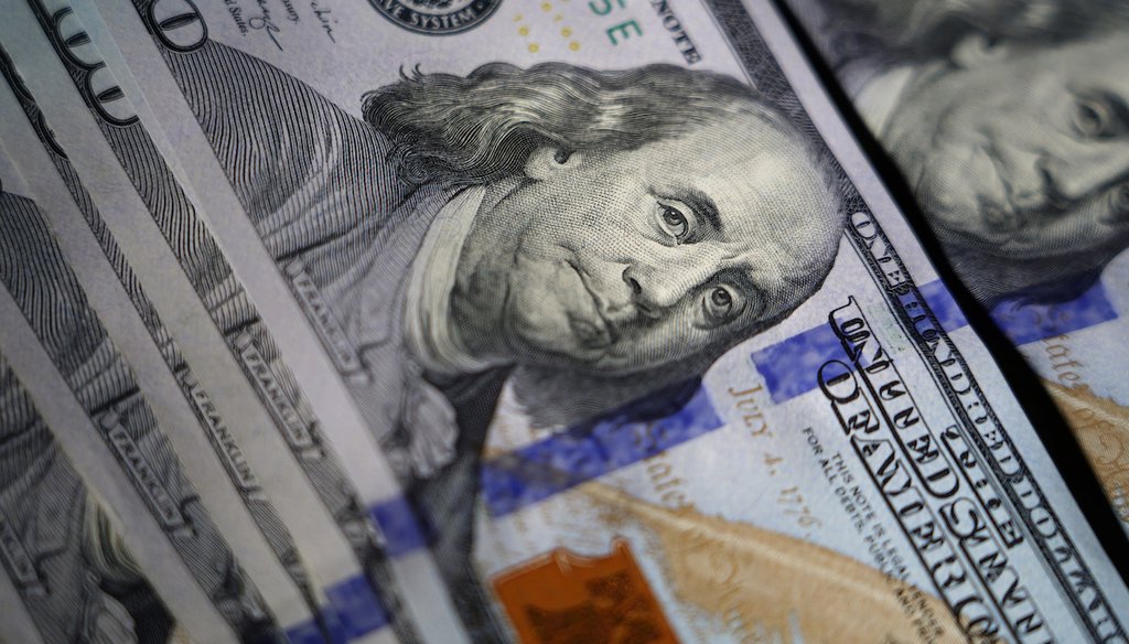 The likeness of Benjamin Franklin is seen on U.S. $100 bills, July 14, 2022, in Marple Township, Pa. (AP)