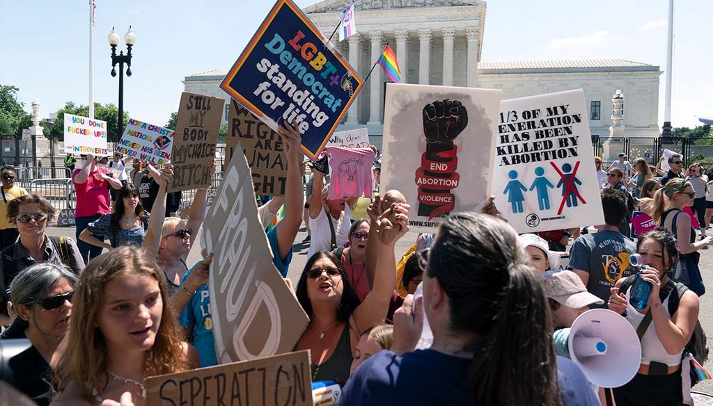 Anti-abortion demonstrators and abortion rights activists protest June 25, 2022, outside the Supreme Court in Washington. (AP)