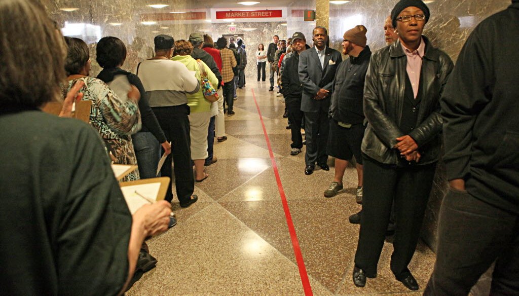 People line up for early voting in the 2012 presidential election. They waited at the Zeidler Municipal Building in Milwaukee. JS photo/Michael Sears