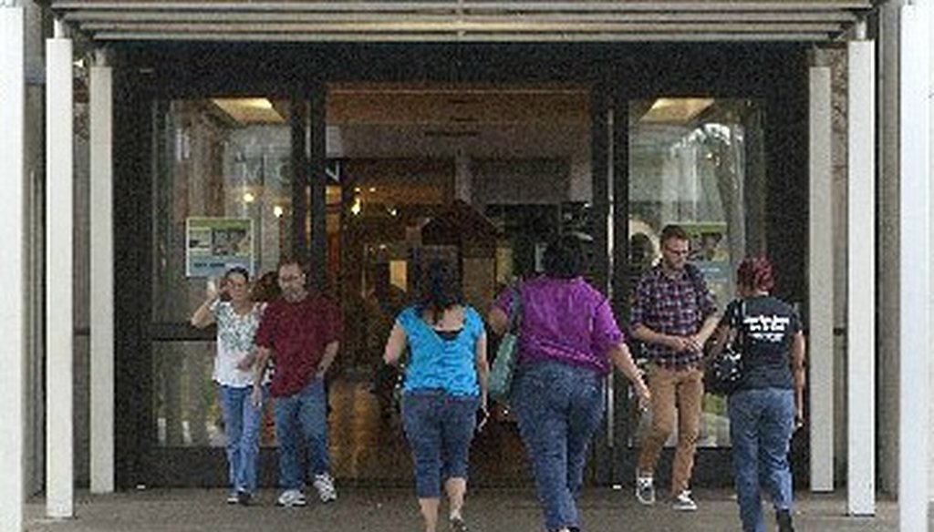 On Oct. 22, 2012, some voters arrive as others leave the early voting site set up by Travis County at Highland Mall (Austin American-Statesman, Alberto Martinez).