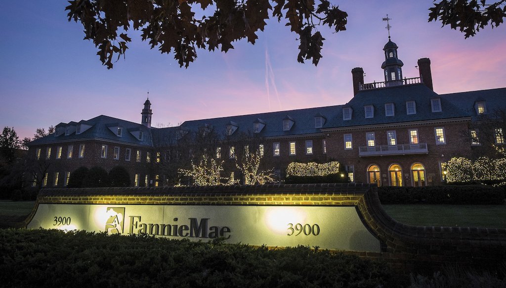 In this Nov. 20, 2013, file photo, the sun sets behind the Fannie Mae headquarters in Washington. (AP)