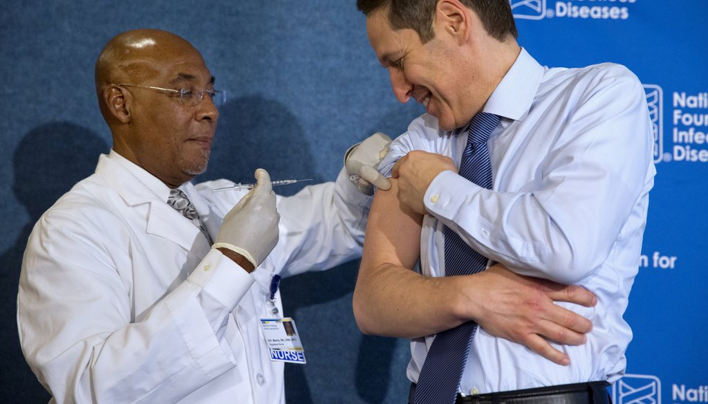 Nurse B.K. Morris, left, prepares to give the flu vaccine to Centers for Disease Control and Prevention Director Dr. Tom Frieden, during an event about the flu vaccine, Thursday, Sept. 17, 2015, at the National Press Club in Washington. It's time for flu 