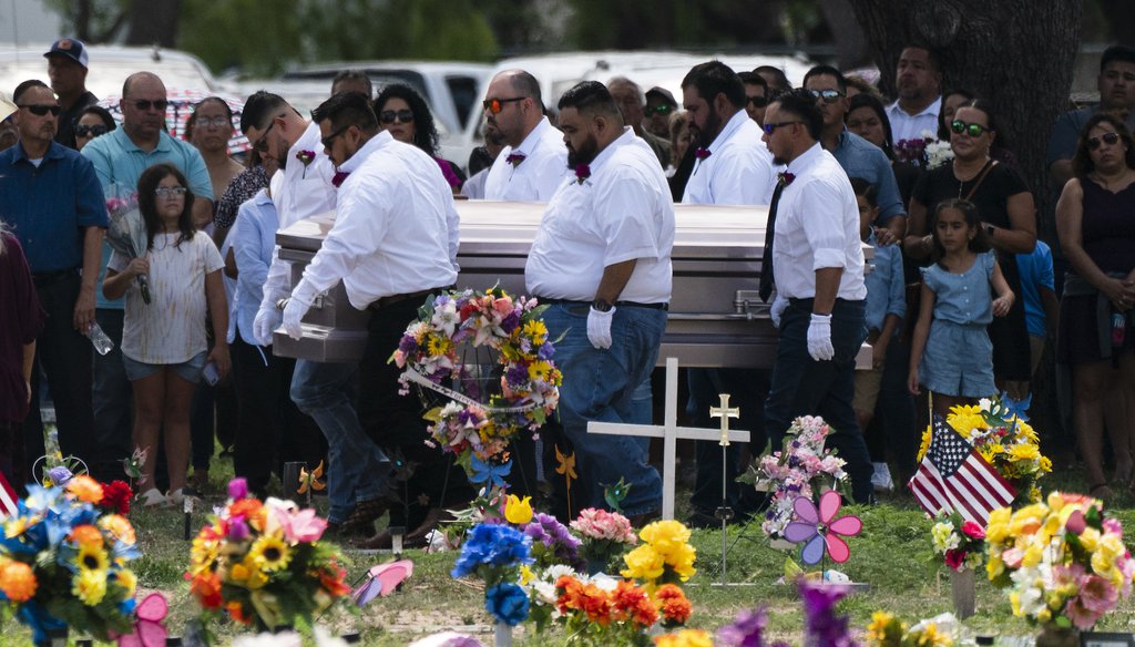 Pallbearers carry the casket of Amerie Jo Garza to her burial site in Uvalde, Texas, on May 31, 2022. Garza was one of the students killed in a shooting at Robb Elementary School. (AP Photo/Jae C. Hong)
