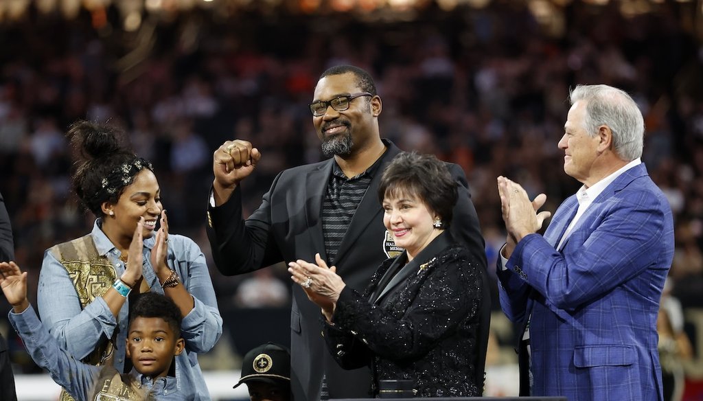 Former New Orleans Saints player Jahri Evans is inducted into the Saints Ring of Honor while accompanied by team owner Gayle Benson and general manager Mickey Loomis, Nov. 17, 2024, in New Orleans. (AP)