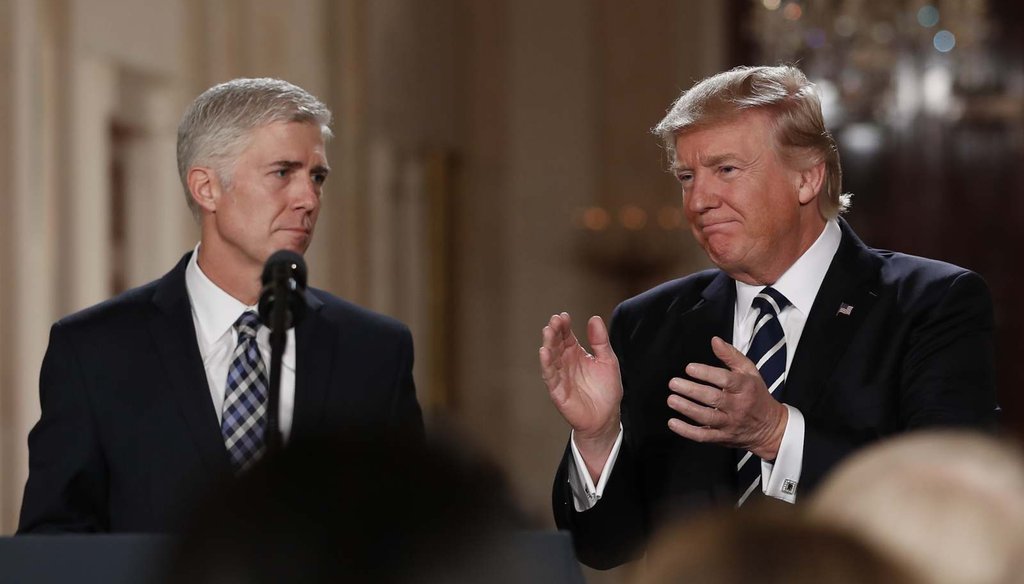 President Donald Trump applauds as he stands with Judge Neil Gorsuch in East Room of the White House in Washington, Tuesday, Jan. 31, 2017, after announcing Gorsuch as his nominee for the Supreme Court. (AP Photo/Carolyn Kaster) 