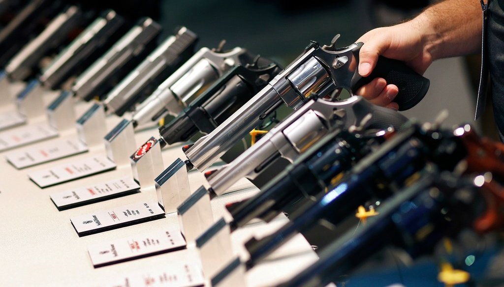 In this Jan. 19, 2016 file photo, handguns are displayed at the Smith & Wesson booth at the Shooting, Hunting and Outdoor Trade Show in Las Vegas. (AP Photo/John Locher)