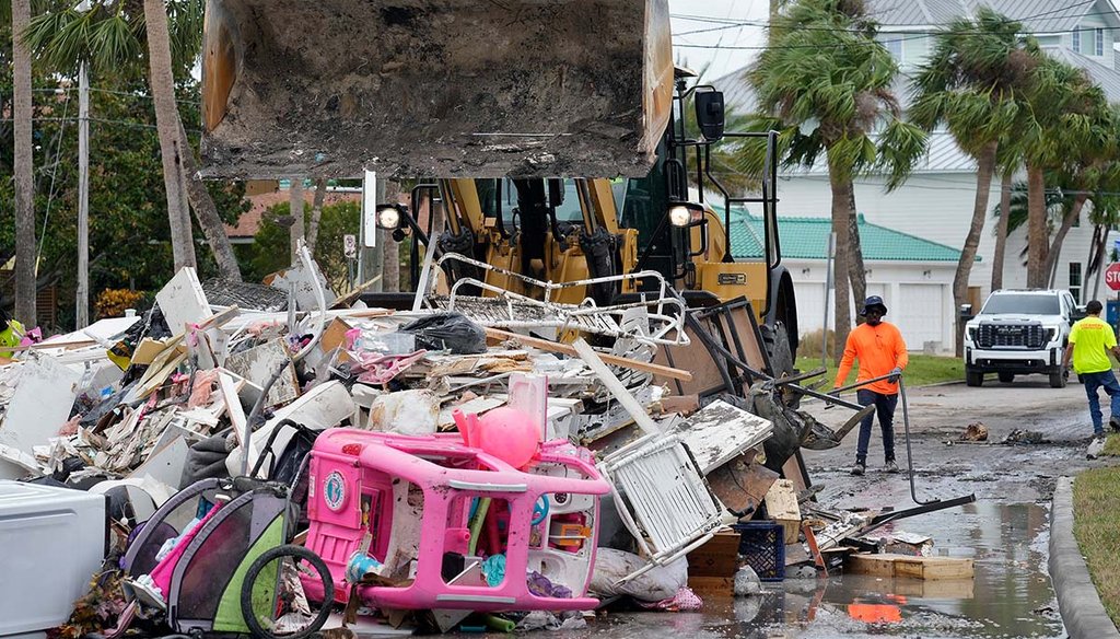 Salvage workers remove debris from Hurricane Helene flooding along the Gulf of Mexico on  Oct. 7, 2024, in Clearwater Beach, Fla. (AP)