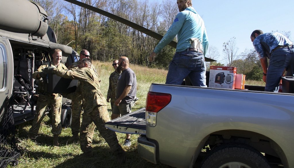 North Carolina Army National Guard 1st Battalion, 131st Aviation Regiment members deliver supplies Oct. 8, 2024, to residents in the aftermath of Hurricane Helene in Elk Park, N.C. (AP)