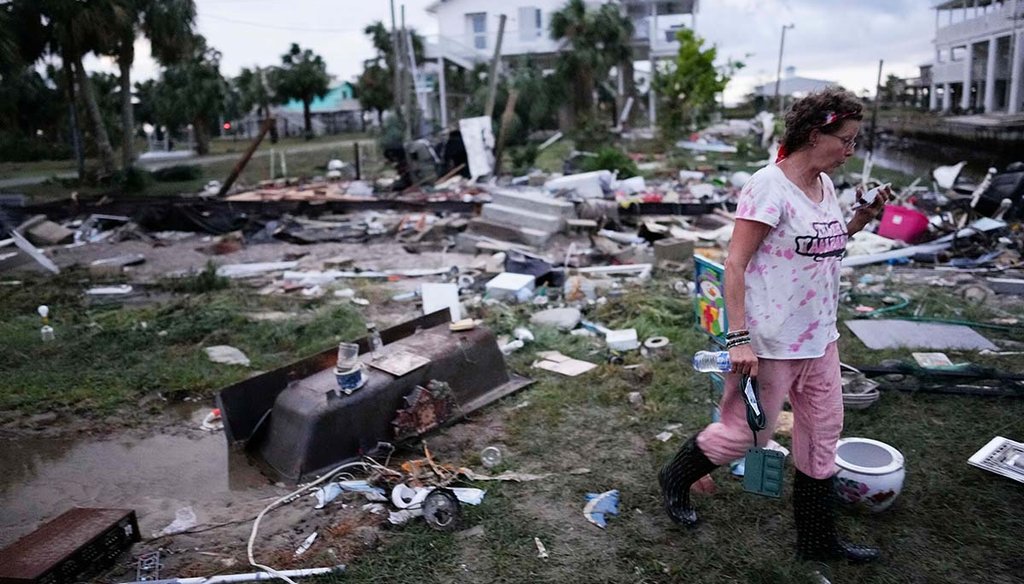 Jewell Baggett walks through debris Aug. 30, 2023, in Horseshoe Beach, Fla., after the passage of Hurricane Idalia. Her mother's home had stood on the lot before the storm hit. (AP)