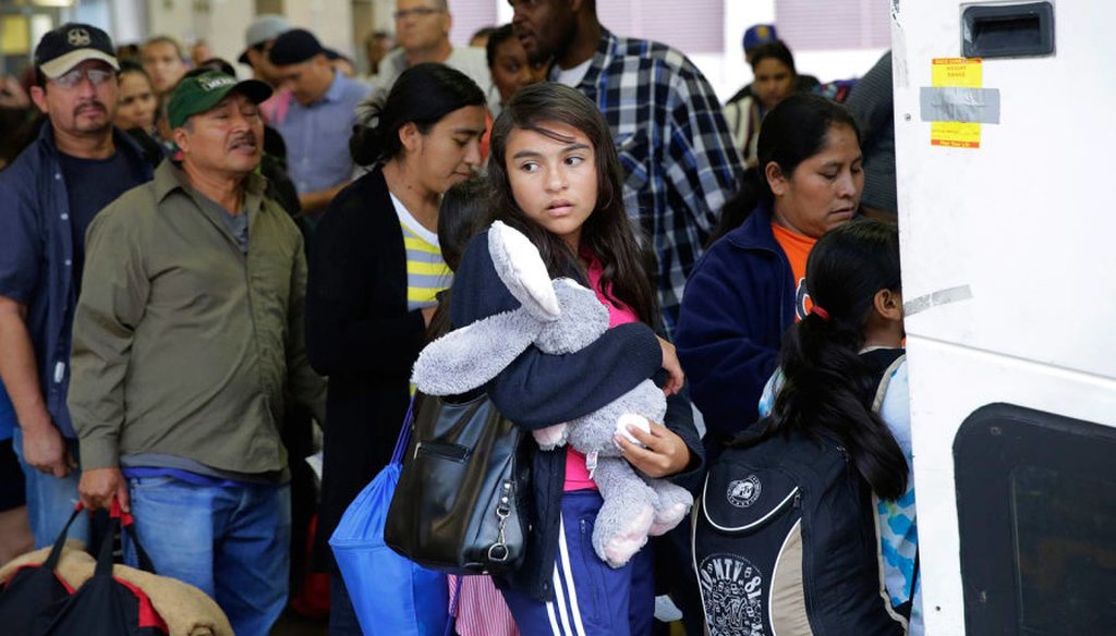 Immigrants from El Salvador and Guatemala board buses to cities across the country to stay with friends and family while they wait for an immigration-court hearing. (AP Photo / Eric Gay)