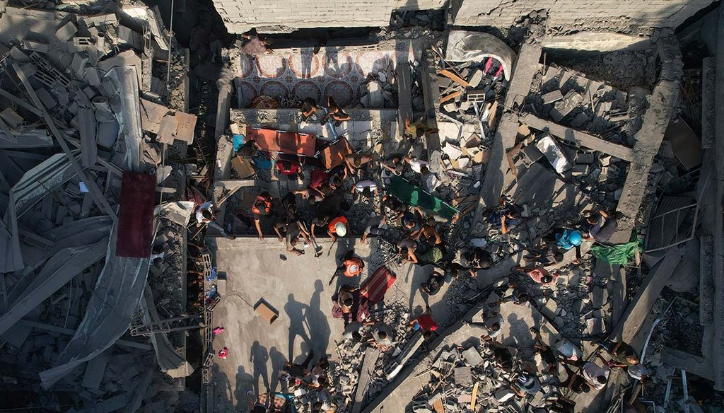 Palestinians inspect the rubble of buildings hit by an Israeli airstrike at Al Shati Refugee Camp on  Oct. 12, 2023. (AP)