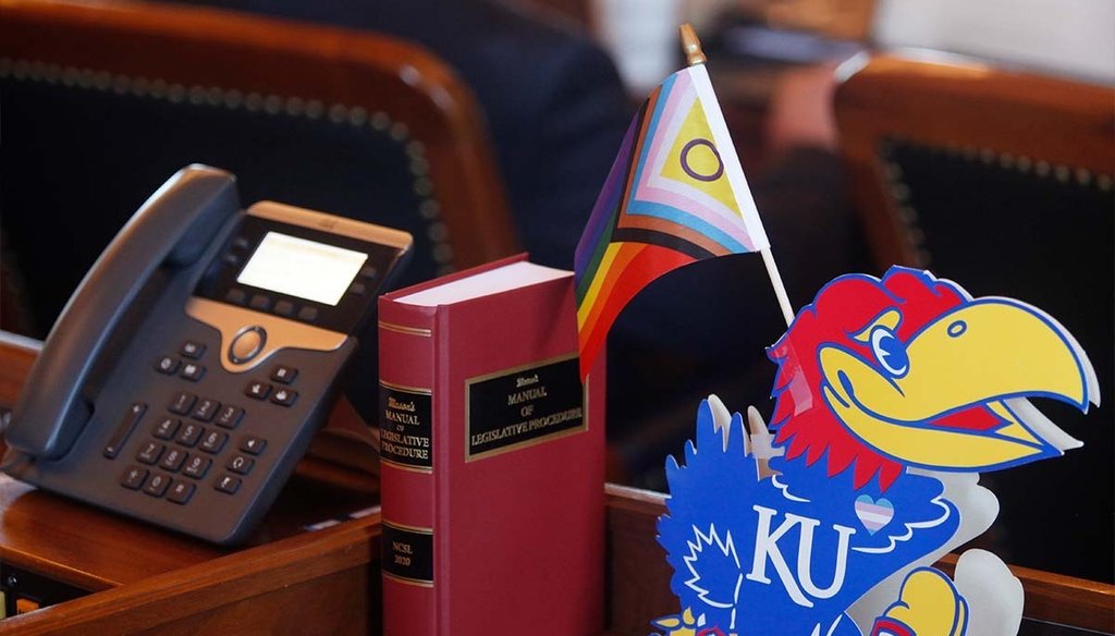 A flag celebrating LGBTQ rights sits on the desk of Kansas state Rep. Brandon Woodard, a vocal opponent of measures to roll back transgender rights. (AP)