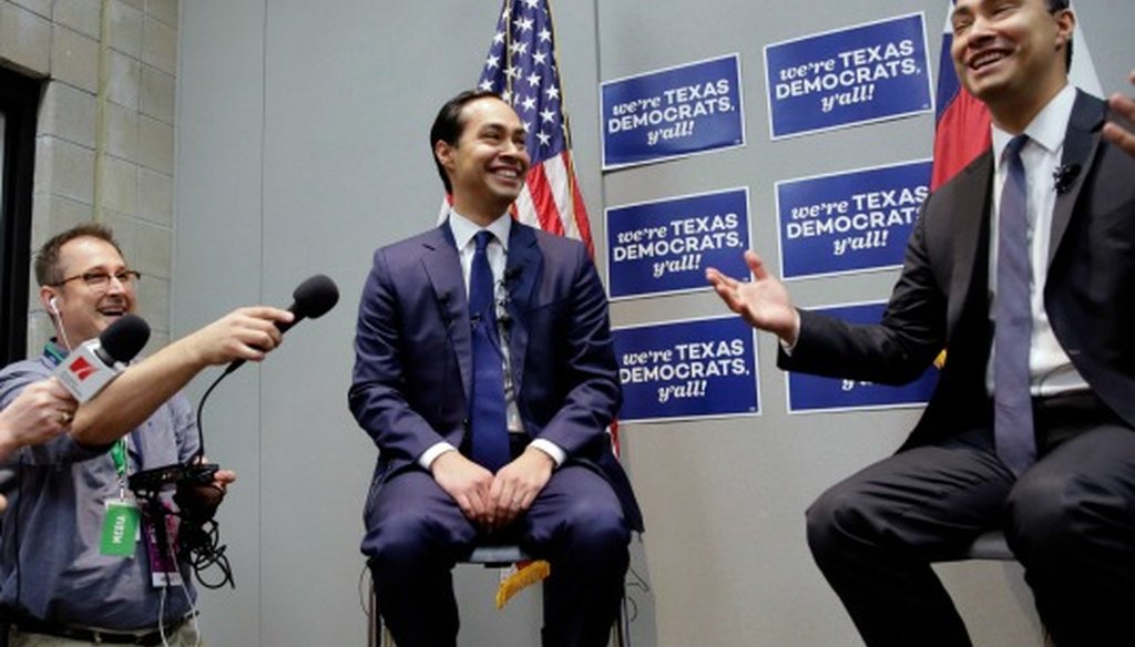 Housing and Urban Development Secretary Julian Castro, left, smiles with his brother during the Texas Democratic Party convention where the secretary made claims comparing the California and Texas economies (Associated Press photo, Eric Gay).