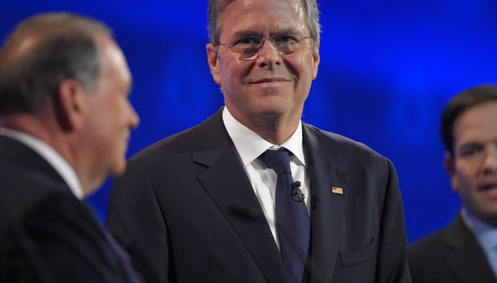 Jeb Bush stands between Mike Huckabee and Marco Rubio at the third GOP presidential debate on Oct. 28, 2015 in Boulder, Colo. (AP photo)