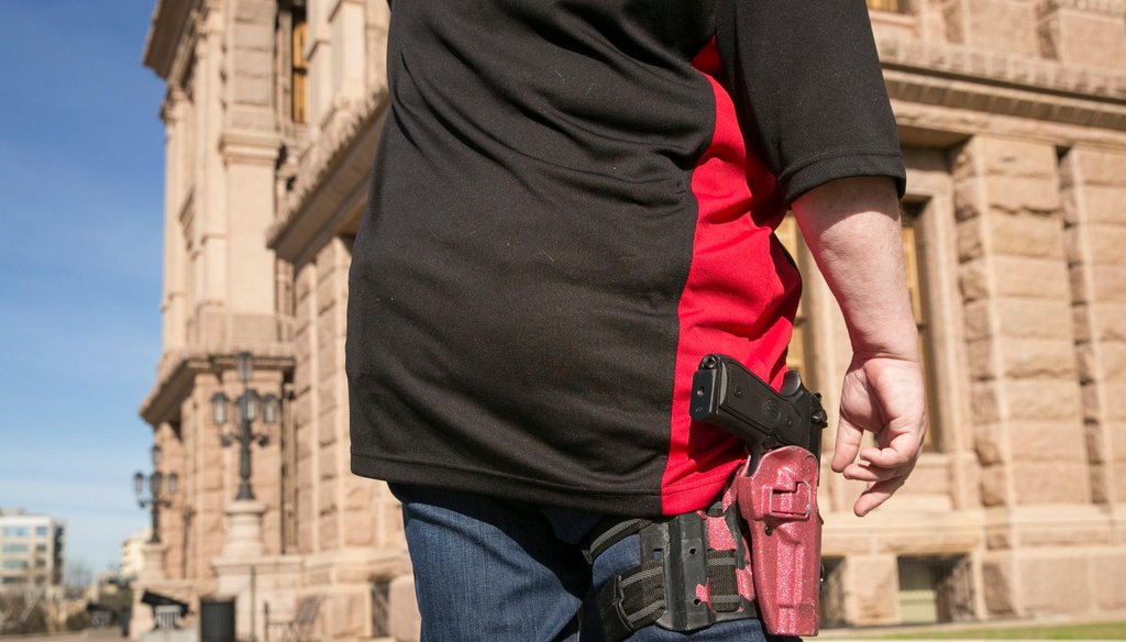 Cheryl Walker of Spring stands outside the Texas Capitol with other members of Open Carry Texas in February 2019  (Jay Janner/Austin American-Statesman)
