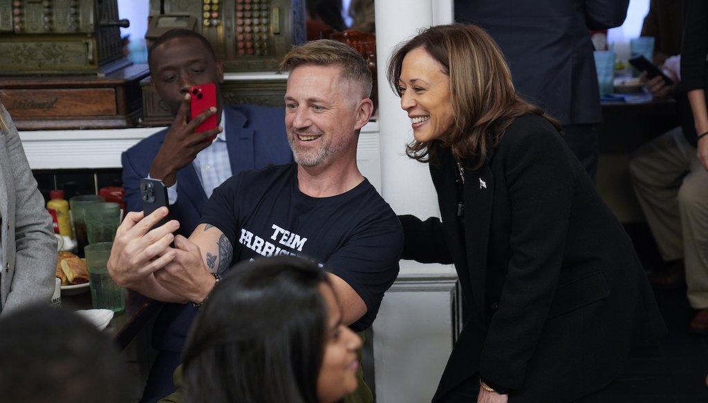 Democratic presidential nominee Vice President Kamala Harris takes a selfie with a patron at a campaign stop at Famous 4th Street Delicatessen in Philadelphia, Wednesday, Oct. 23, 2024. (AP)