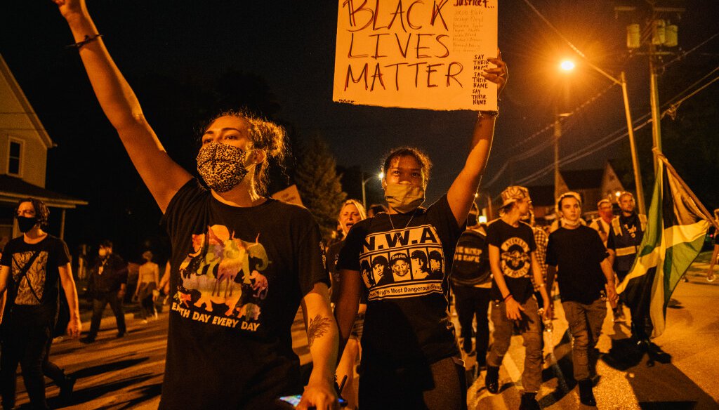 Demonstrators chant in a march on August 26, 2020 in Kenosha, after a fourth night of civil unrest occurred following the shooting of Jacob Blake. (Photo by Brandon Bell/Getty Images)