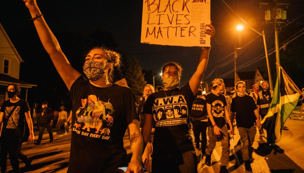 Demonstrators chant in a march on August 26, 2020 in Kenosha, after a fourth night of civil unrest occurred following the shooting of Jacob Blake.   (Photo by Brandon Bell/Getty Images)