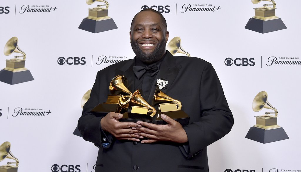 Killer Mike poses in the press room Feb. 4, 2024, with the awards for best rap performance, best rap song and best rap album during the 66th annual Grammy Awards in Los Angeles. (Invision/AP)